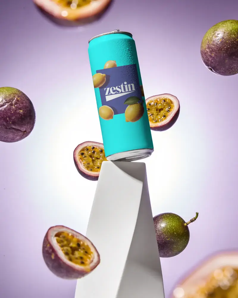 Sleek Cold Beverage Can Mockup With Floating Passion Fruits On Gradient Background