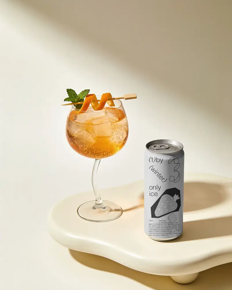 Sleek Tall Can Mockup With Elegant Fizzy Cocktail Glass Ideal For Beverage Packaging Design