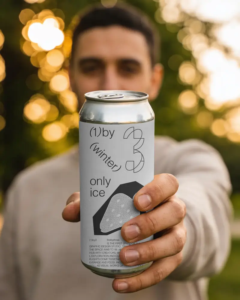 Realistic Can Mockup In Hand Perfect For Drink Packaging Design Presentations Outdoors