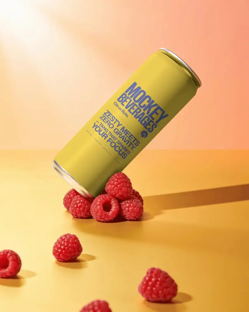 Sleek Aluminum Beverage Can Mockup With Fresh Raspberry Fruit On Minimalist Table Background