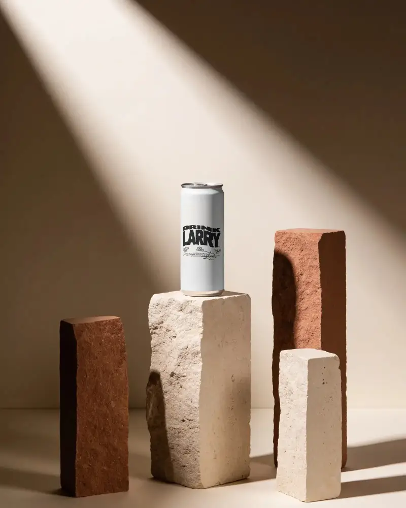 Sleek Tall Can Mockup On Natural Stone Pedestal With Soft Light And Shadow