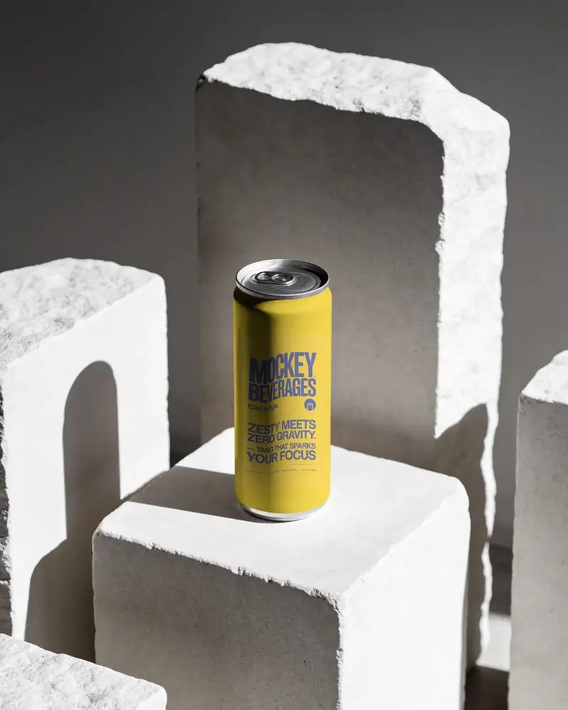 Sleek Tall Can Mockup On Rough Textured Stone Block Minimalist Product Display