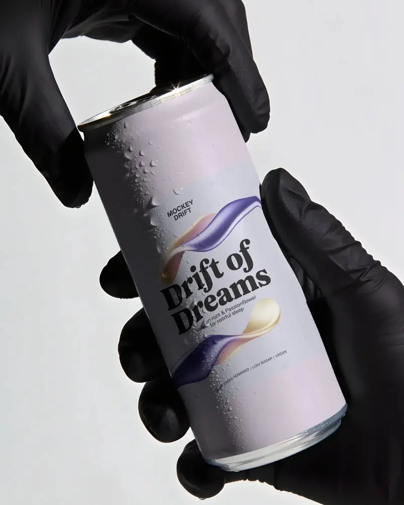 Premium Beverage Can Mockup Held By Gloved Hands Showcasing Condensation For Refreshing Look