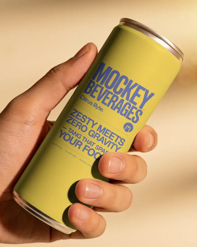 Hand Holding Sleek Beverage Can Mockup For Product Promotion And Branding Presentation