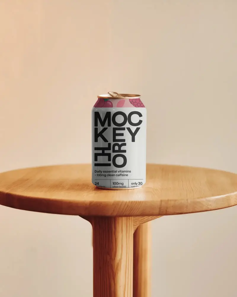 Soda Can On Wooden Round Table Against Warm Gradient Wall For Refreshment Label Mockup