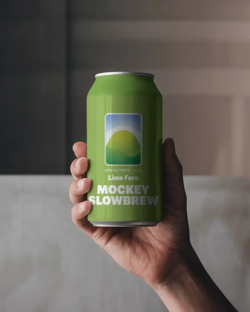 Matte Finish Can Mockup Held Upright Against Subtle Backdrop And Diffused Evening Light