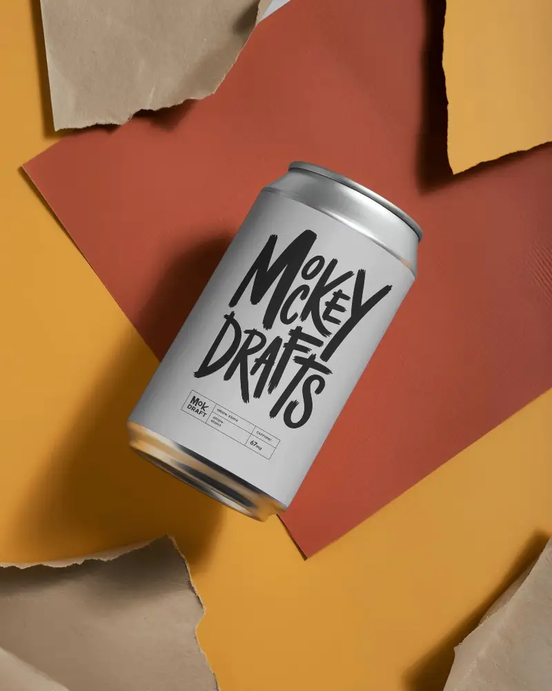 Isolated Plain Aluminum Can Mockup On Colorful Ripped Paper Textured Background