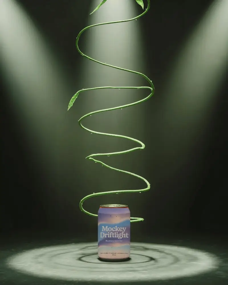 Modern Beverage Can Mockup Highlighted By Spiraling Greenery Accents