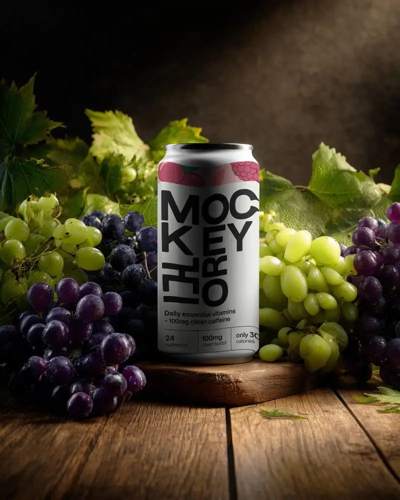 Premium Beverage Can Mockup Surrounded By Fresh Grape Bunches For Wine And Juice