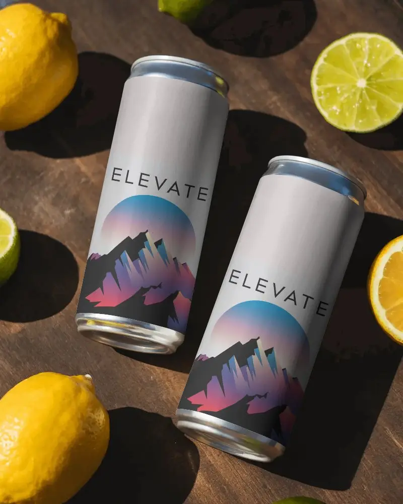 Realistic Metallic Drink Can Mockups With Citrus Fruits On Rustic Wooden Table