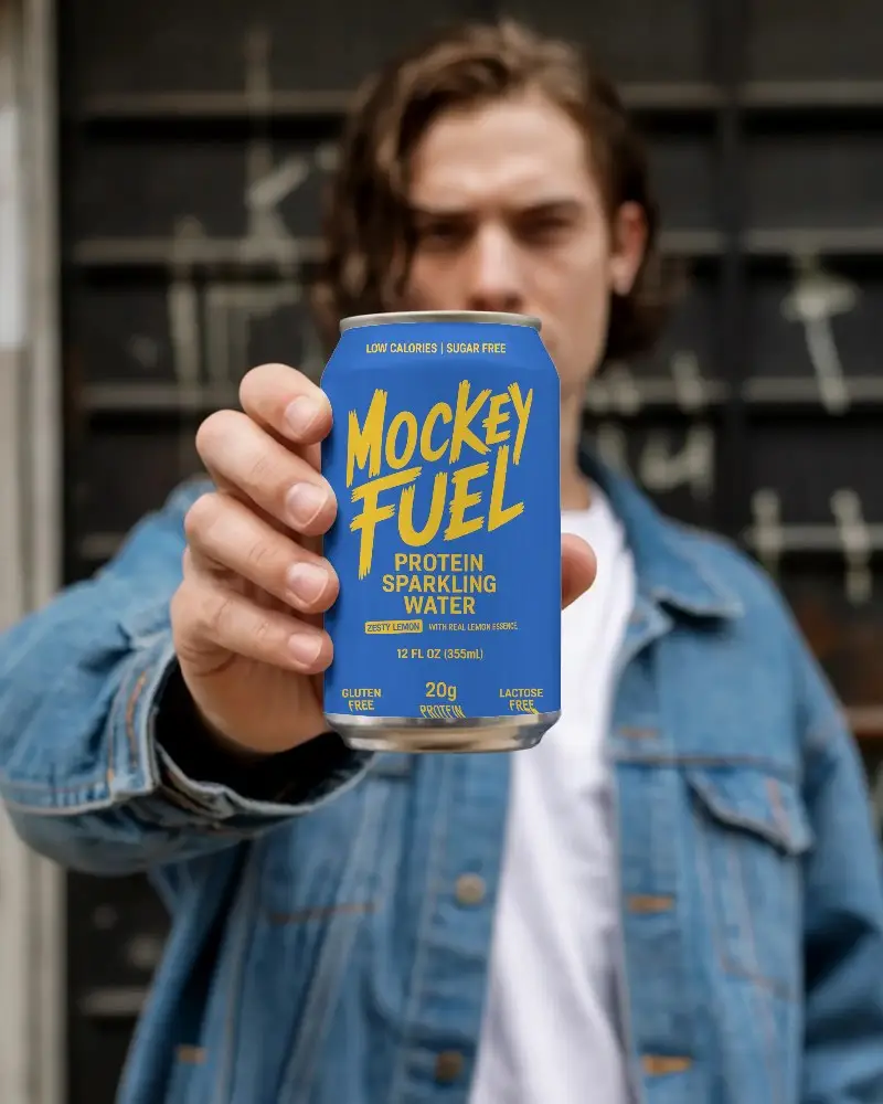 Urban Style Young Man Showing Empty Can Mockup For Beverage Marketing Presentation