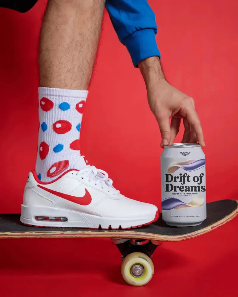 Hand Grasping Metal Can Mockup While Balancing On Skateboard For Sporty Drink