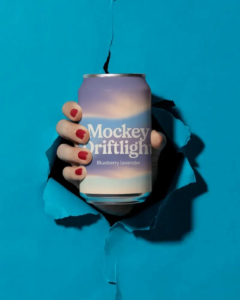 Realistic Beverage Can Mockup With Ripped Background And Hand Grip Perfect For Design