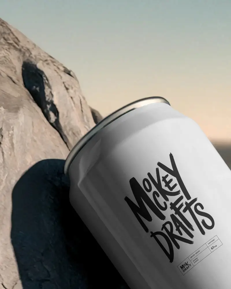 Sleek Aluminum Beverage Can Mockup On Natural Rock Background For Label Design