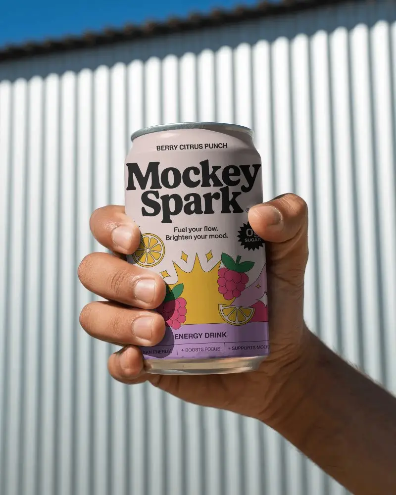 Hand Holding Blank Can Mockup For Beverage Branding And Packaging Design Presentations