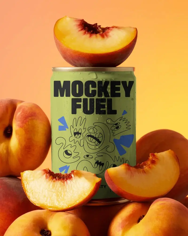 Chilled Soft Drink Can Mockup With Vibrant Peach Fruit Slices And Whole Peaches Background
