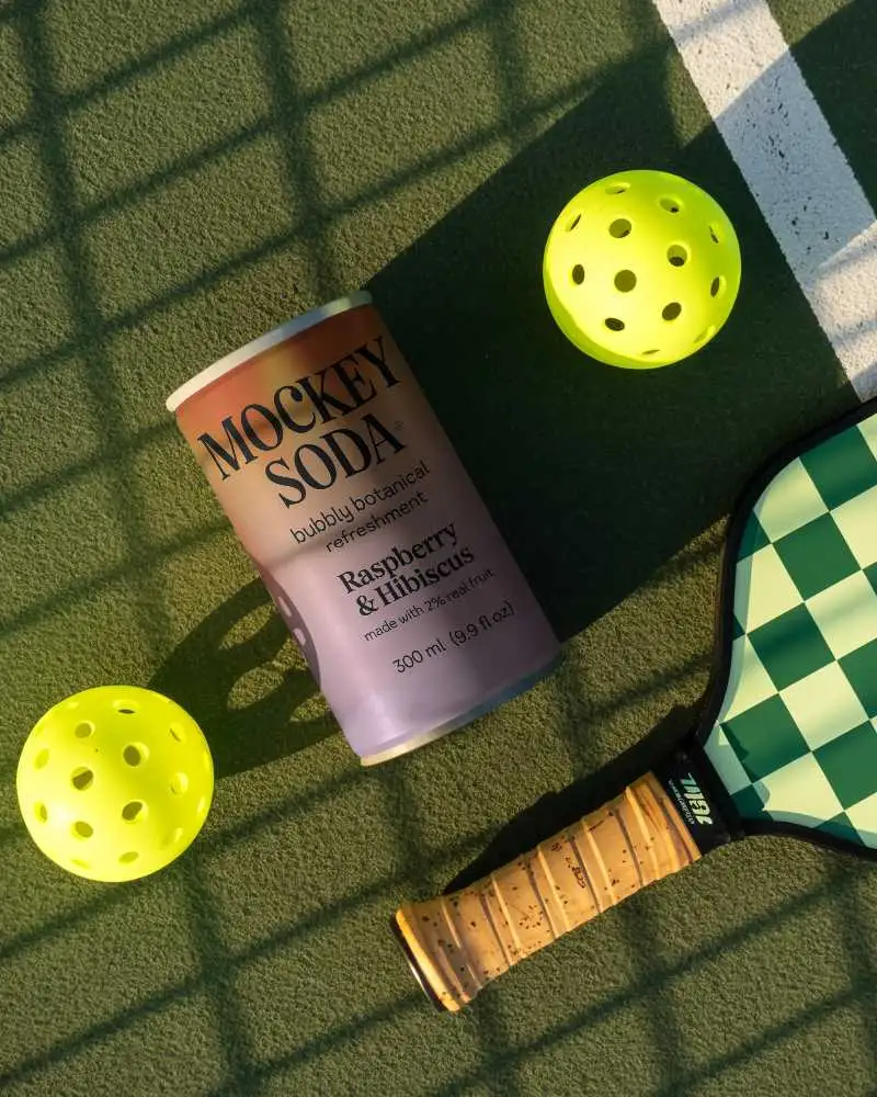 Realistic Can Mockup For Branded Sports Drink Display On Textured Playing Field