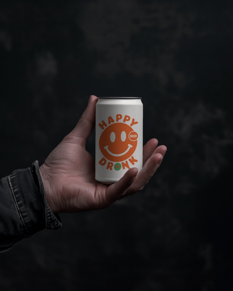 Premium Dark Aesthetic Soda Can Mockup Hand Holding Trendy Smiley Design On Modern Label