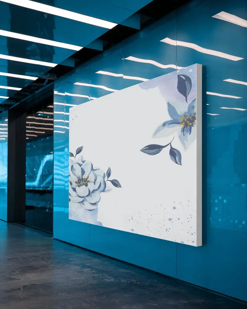 Futuristic Office Canvas Mockup Mounted On Glossy Blue Wall Modern Lighting Reflective Surfaces Sleek Corporate Vibe