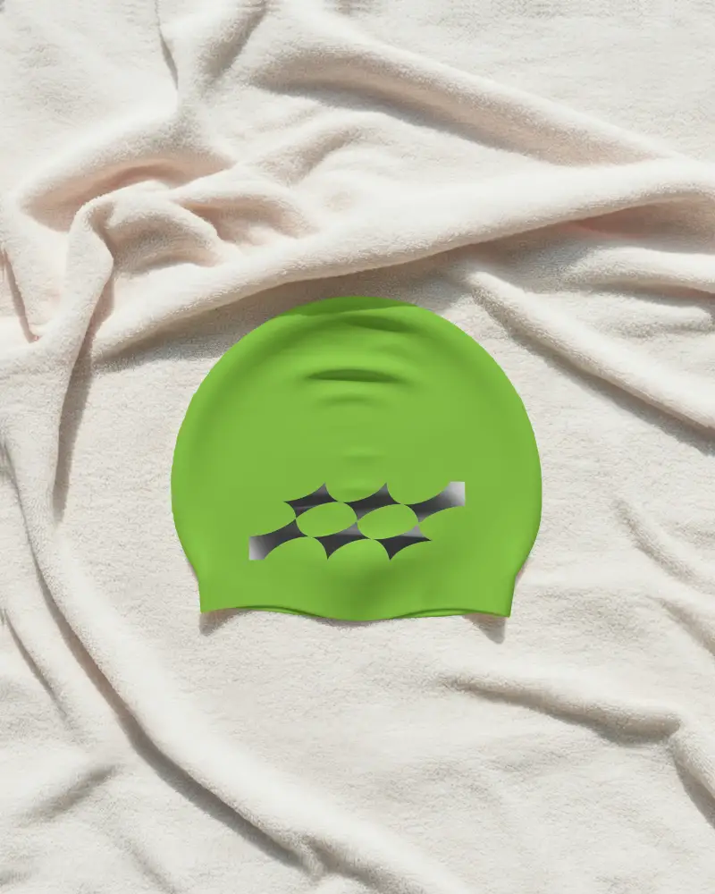 Sleek Swim Cap Mockup On Wrinkled Fabric Backdrop For Athletic And Activewear Branding