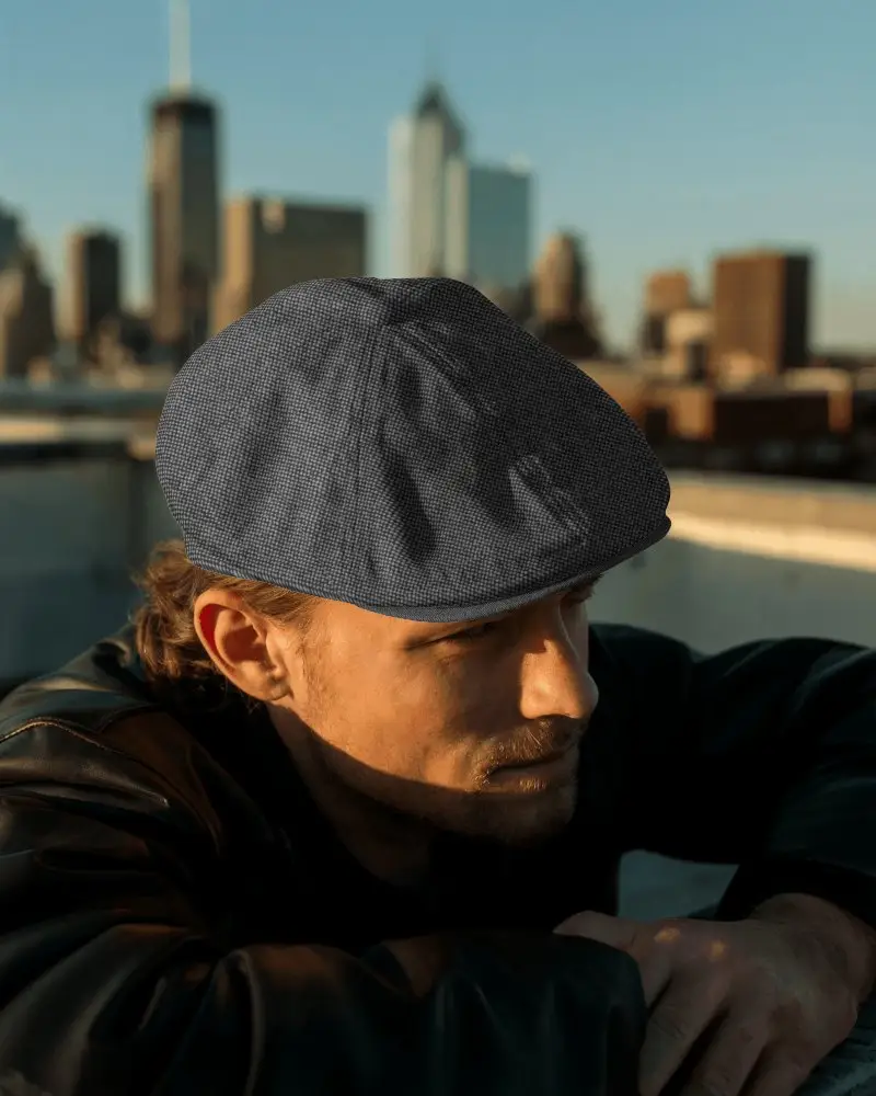 Sunset Rooftop Flat Cap Mockup Worn By Man In Leather Jacket With Urban Skyline In Background