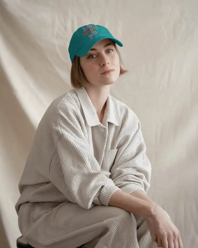 Custom Designed Light Blue Cap Mockup With Your Logo On Female Model In Casual Corduroy Ensemble Against Soft Neutral Background