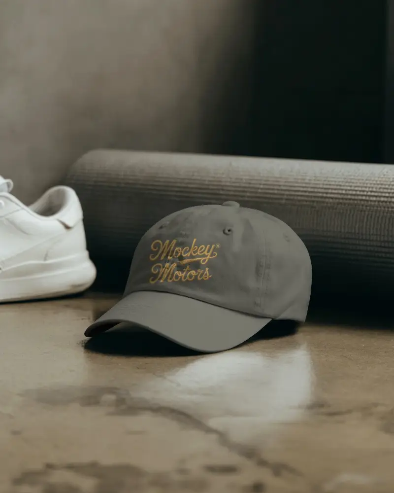 Minimalistic Cap Mockup Displayed On Floor With Athletic Shoe And Yoga Mat