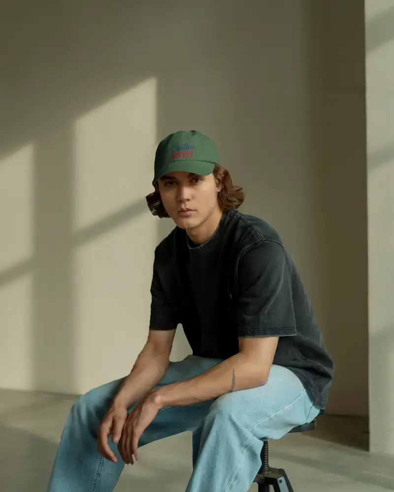 Editorial Cap Mockup With Male Model Soft Window Lighting Modern Setting