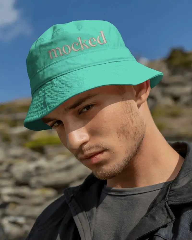 Rugged Bucket Hat Mockup On Model In Sunny Mountain Outdoor Setting