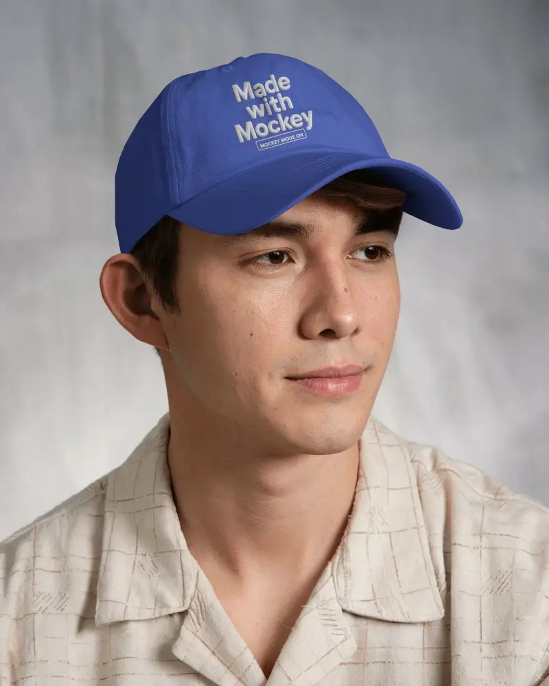 Clean Casual Trucker Cap Mockup On Male Model In Soft Neutral Studio Lighting
