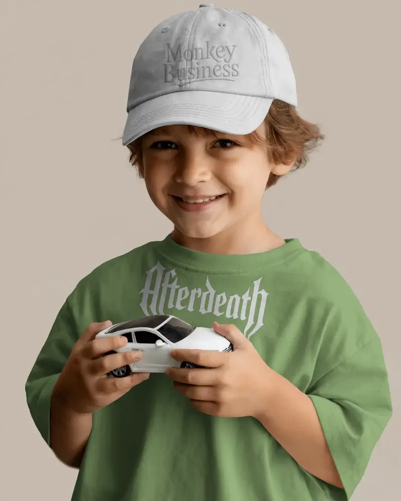 Joyful Kid Donning Casual Cap Mockup Playtime With Small Car Model