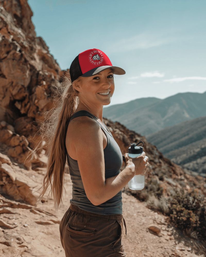 Athletic Mountain Hiking Hat Mockup Woman In Stylish Trucker Cap Exploring Nature With Fresh Energy