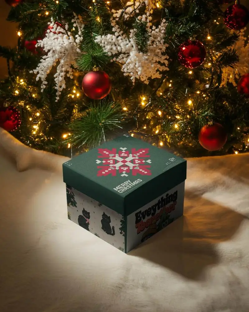 Christmas Gift Box Mockup Under Decorated Tree With Glowing Lights And Holiday Ornaments