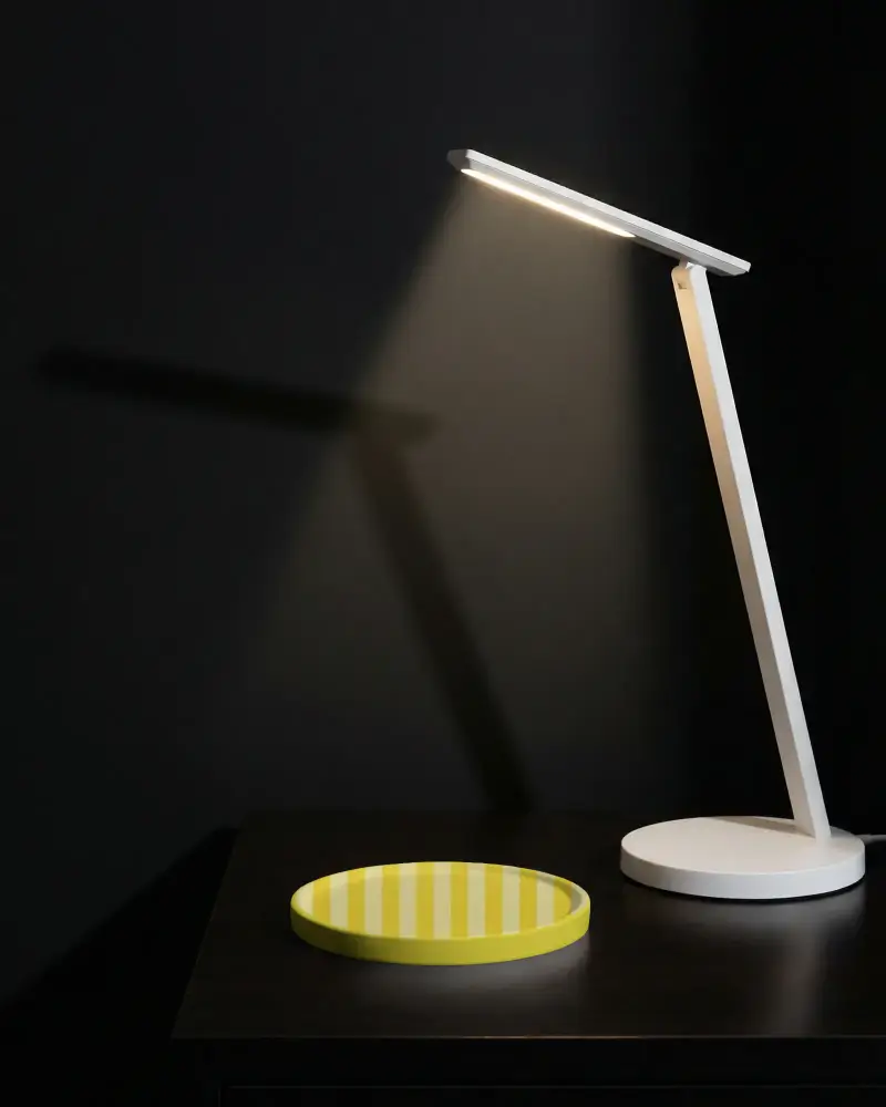 Simple Flat Round Coaster Mockup On Clean Desk Beneath Adjustable Led Lamp