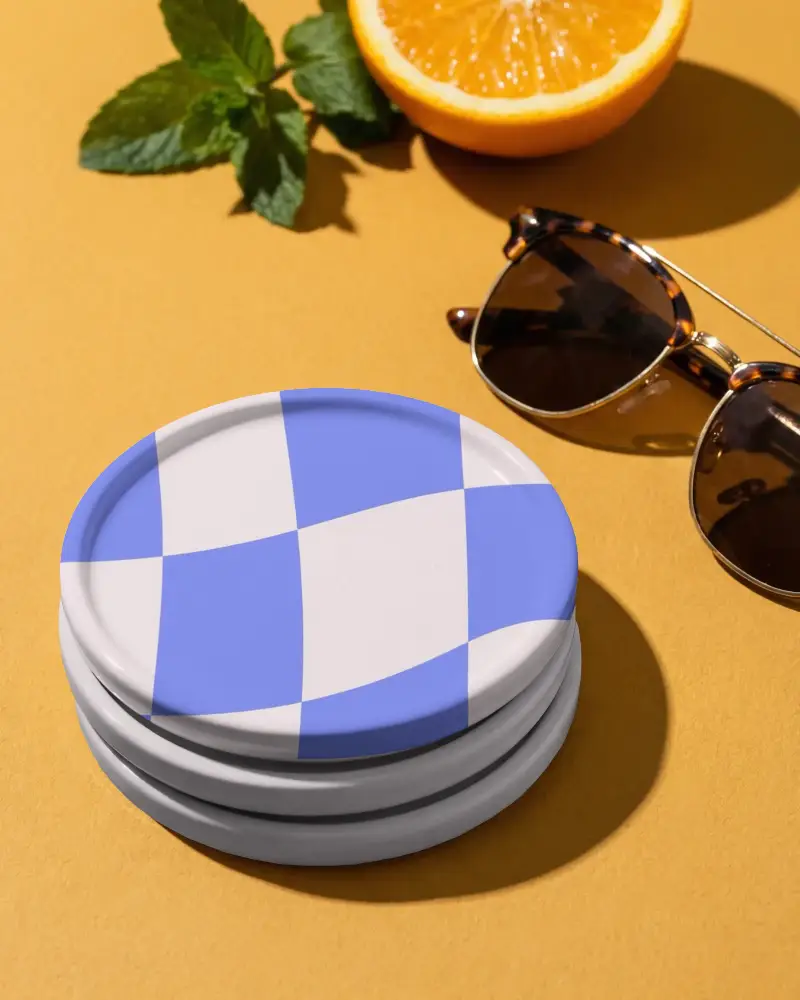 Stack Of Minimalist Round Ceramic Coasters Mockup Plain Background With Sunglasses And Orange