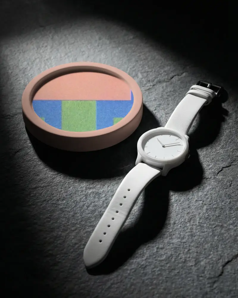 Premium Leather Strap Timepiece With Clean Face Placed Adjacent To Round Coaster Mockup