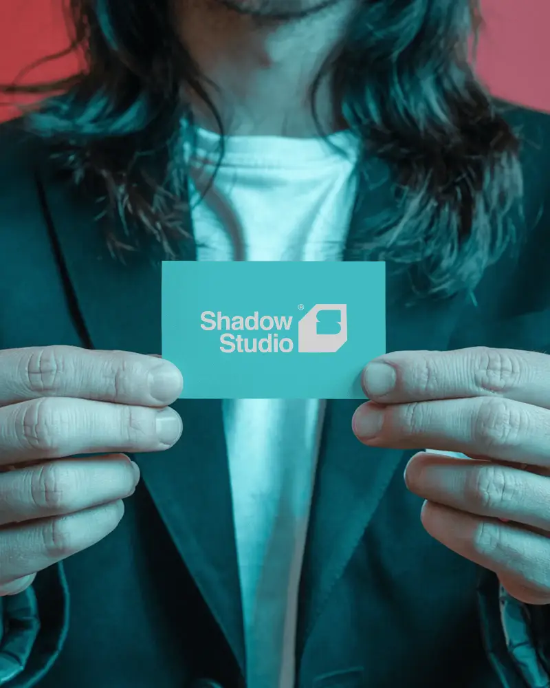 Person Holding Blank Business Card Logo Mockup Closeup Showcasing Corporate Branding Materials