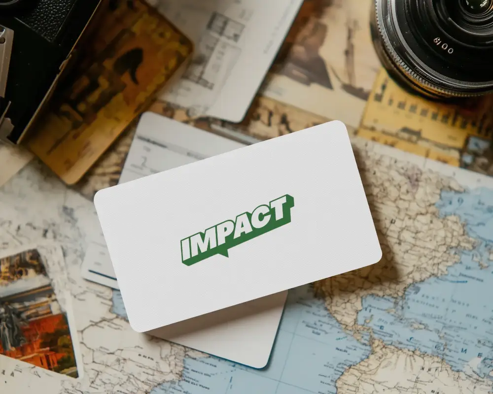 Vintage Travel Themed Business Card Logo Mockup On World Map With Camera And Postcards