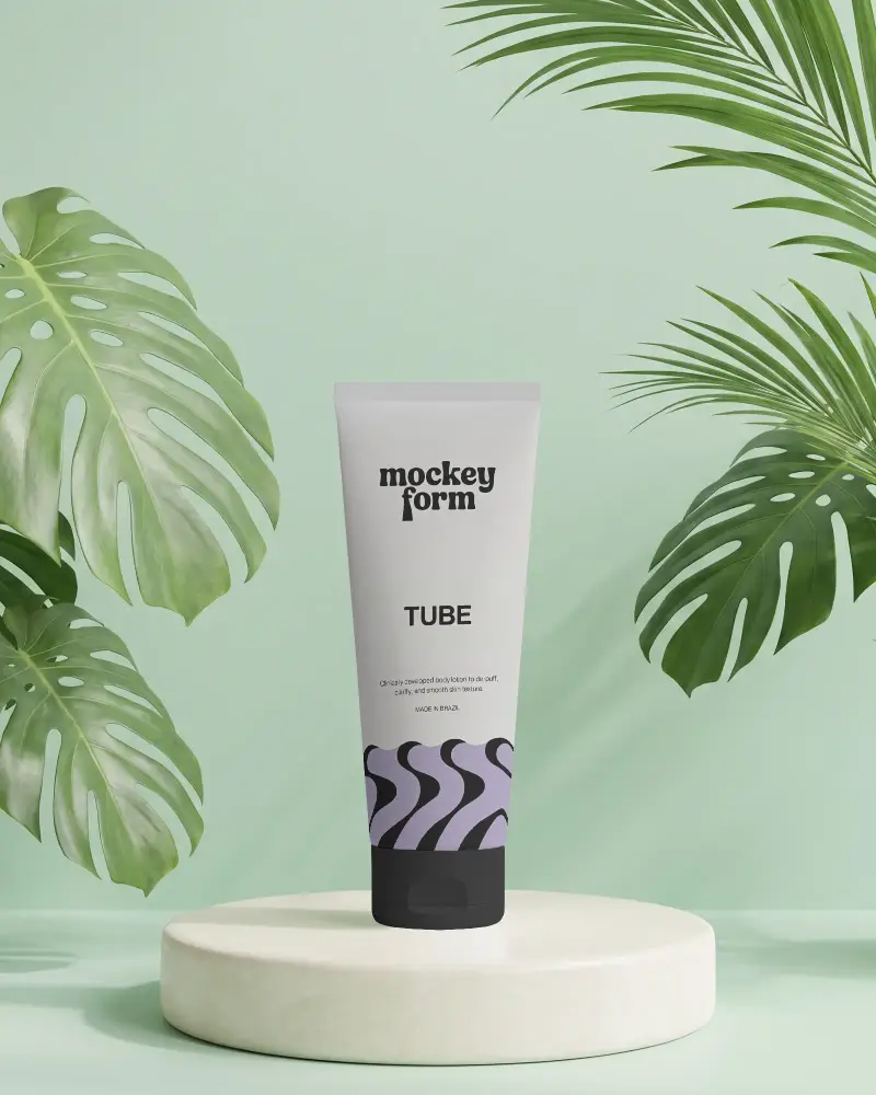 Sleek Cosmetic Tube Mockup On Minimalist Stand With Tropical Leaves Background Design