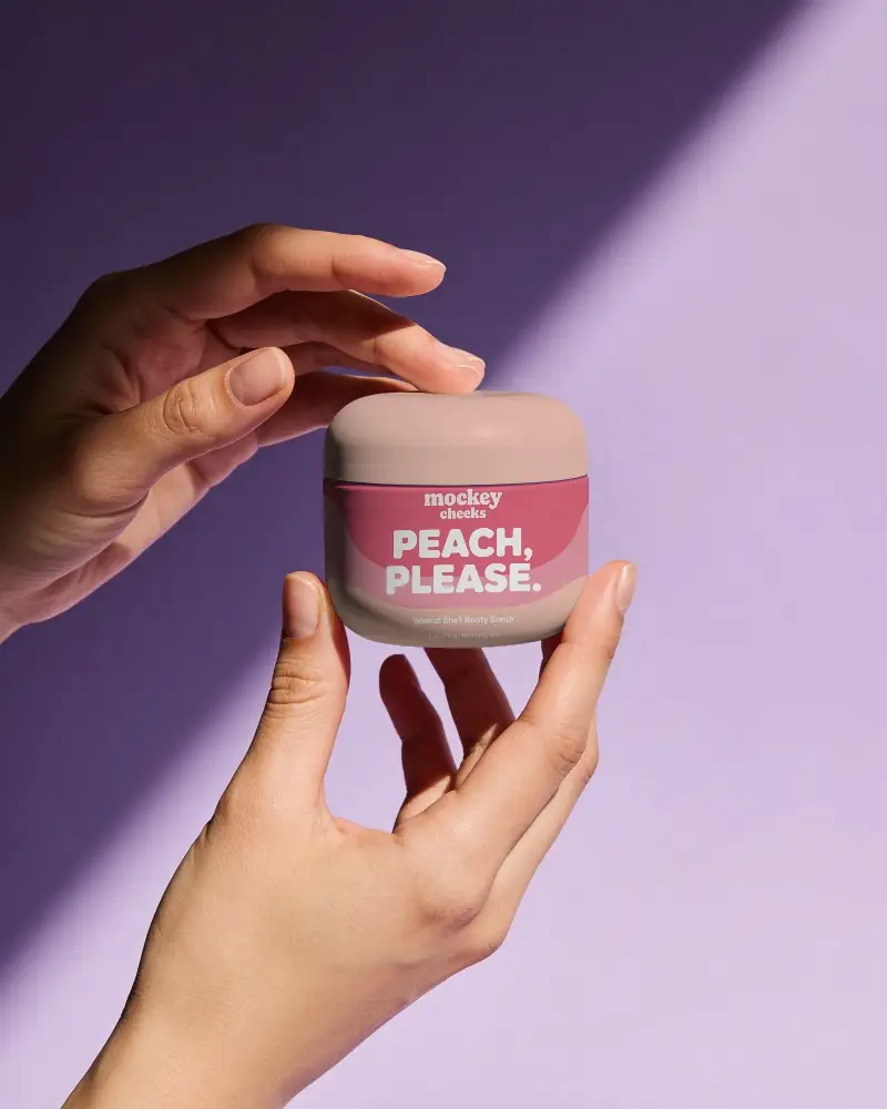 Premium Skin Care Jar Mockup Held By Hands For Cosmetic Product Presentation