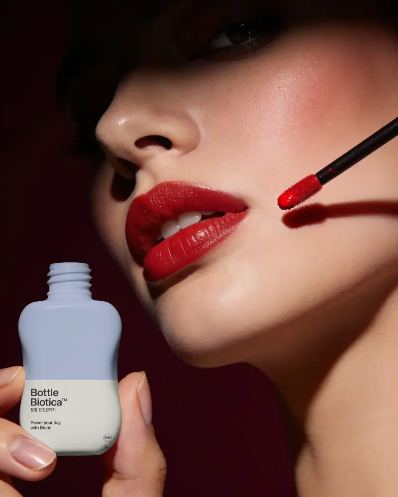 Cosmetic Mockup Showing Lip Color Product In Hand With Perfect Lipcare Texture Glow