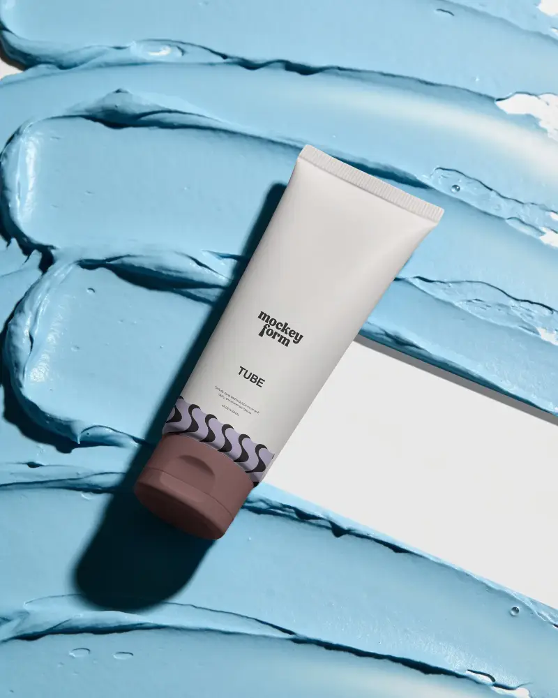 Blank Cosmetic Tube Mockup On Abstract Textured Cream Background For Product Display