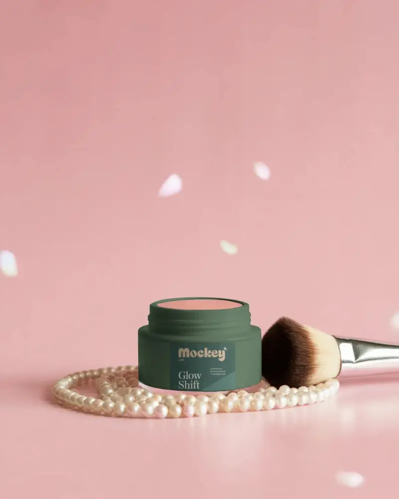 Compact Blush Jar Cosmetic Mockup On Pink Surface With Pearl Necklace Petals And Brush In Soft Glow