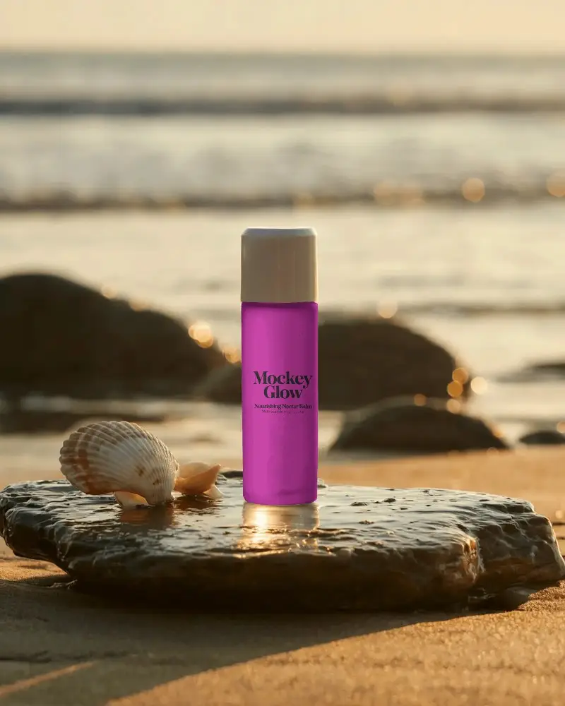Sleek Cosmetic Bottle Mockup For Beauty Product Presentation On Natural Beach Surface