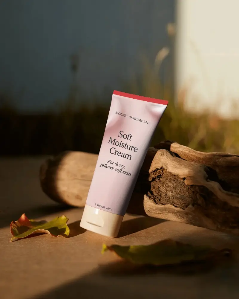 Cosmetic Tube Mockup Placed On Wooden Surface With Natural Elements And Soft Light