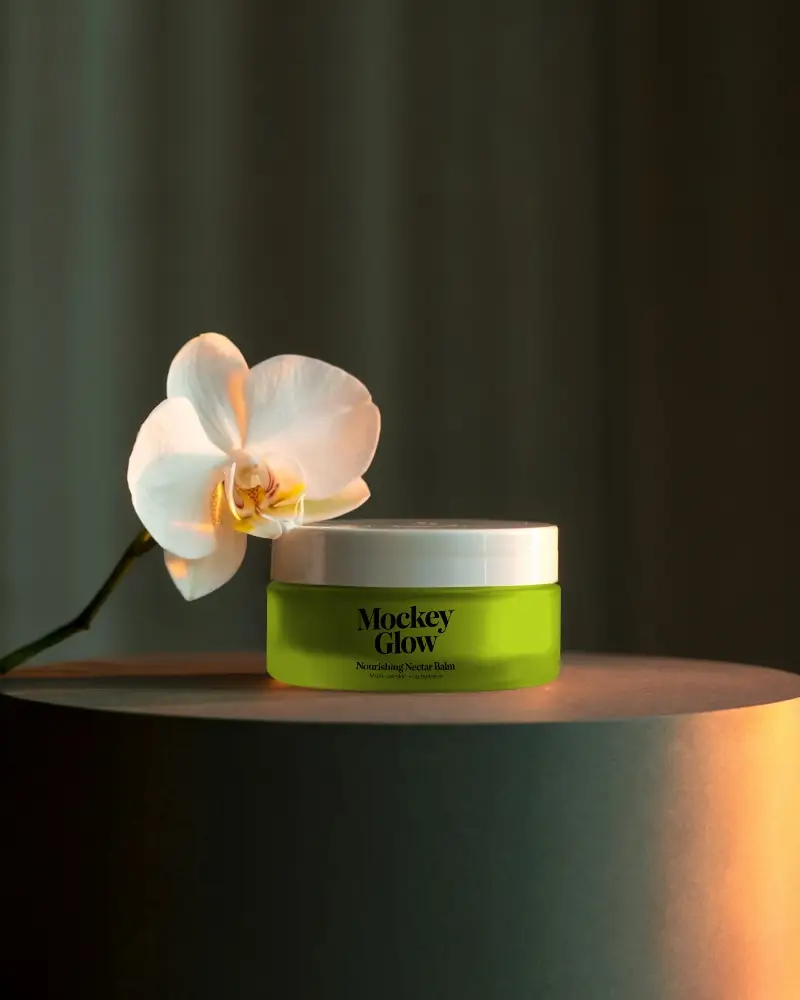 Luxury Skincare Jar Mockup Orchid Inspired Product Display Warm Toned Editorial Lighting