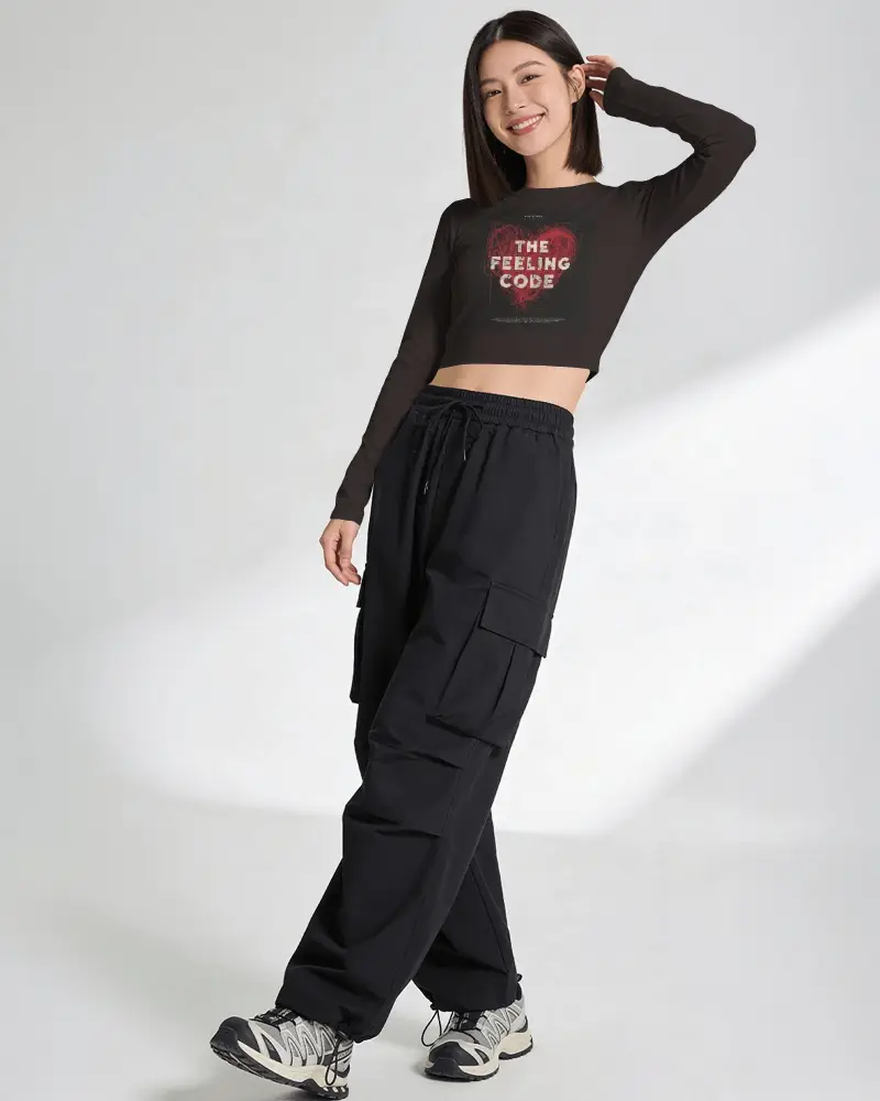 Long Sleeve Crop Top Mockup Female Model Smiling In Clean White Studio With Cargo Pants