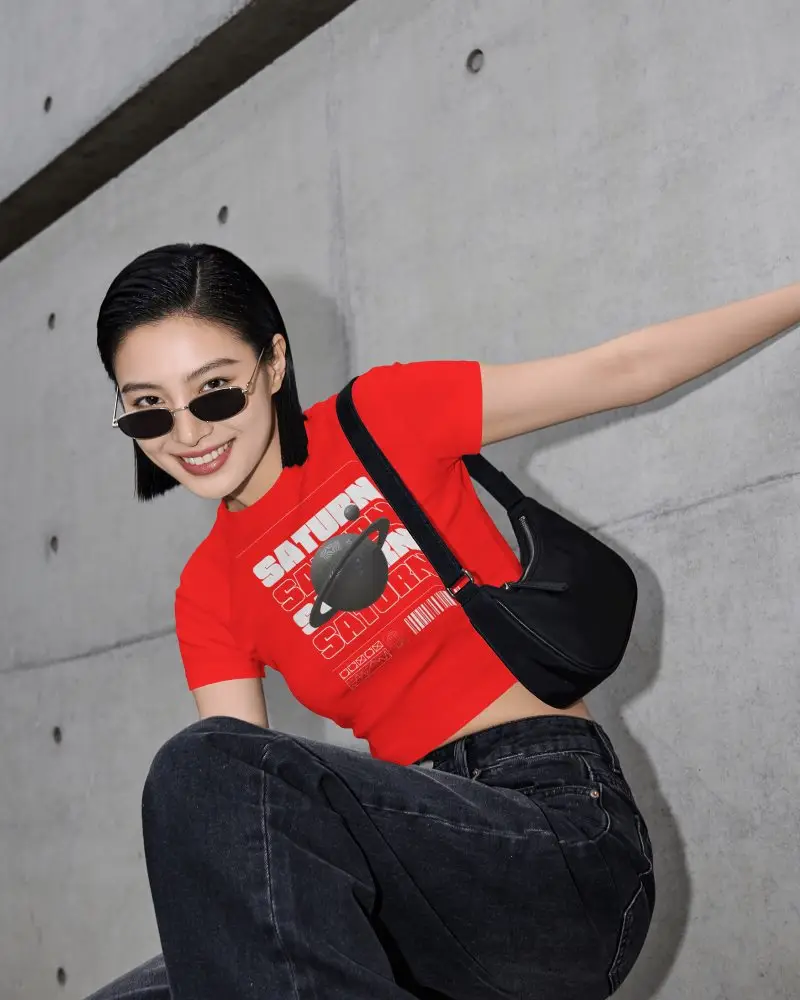 Short Sleeve Crop Top Mockup Female Model Crouching Against Wall With Sunglasses And Urban Pose