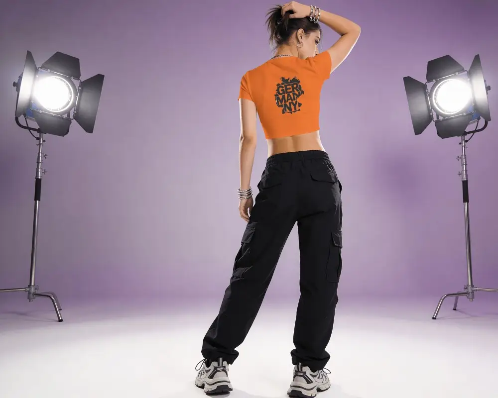 Stylish Crop Top Apparel Mockup With Model Posing Against Studio Lighting Background
