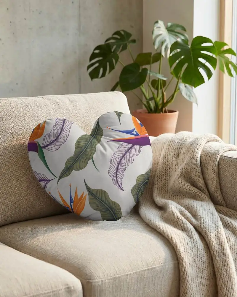 Heart Shaped Cushion Mockup On Cozy Sofa With Textured Knitted Throw And Nature Plant